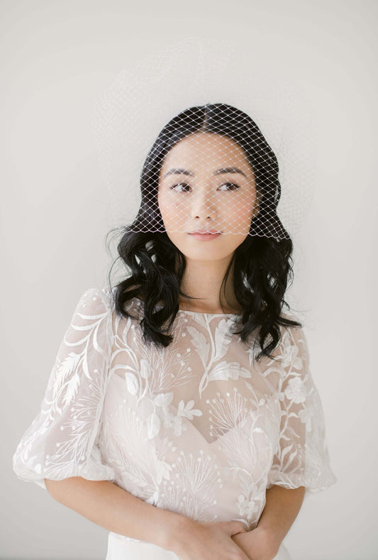 What is the purpose of a birdcage veil?