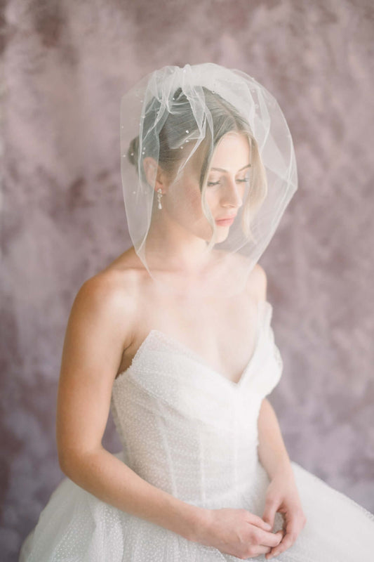 Do you flip a birdcage veil?