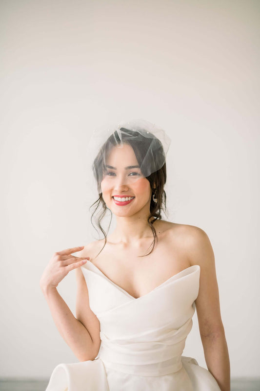 Featured product: Bridal tulle birdcage veil with pearl accents Tessa Kim