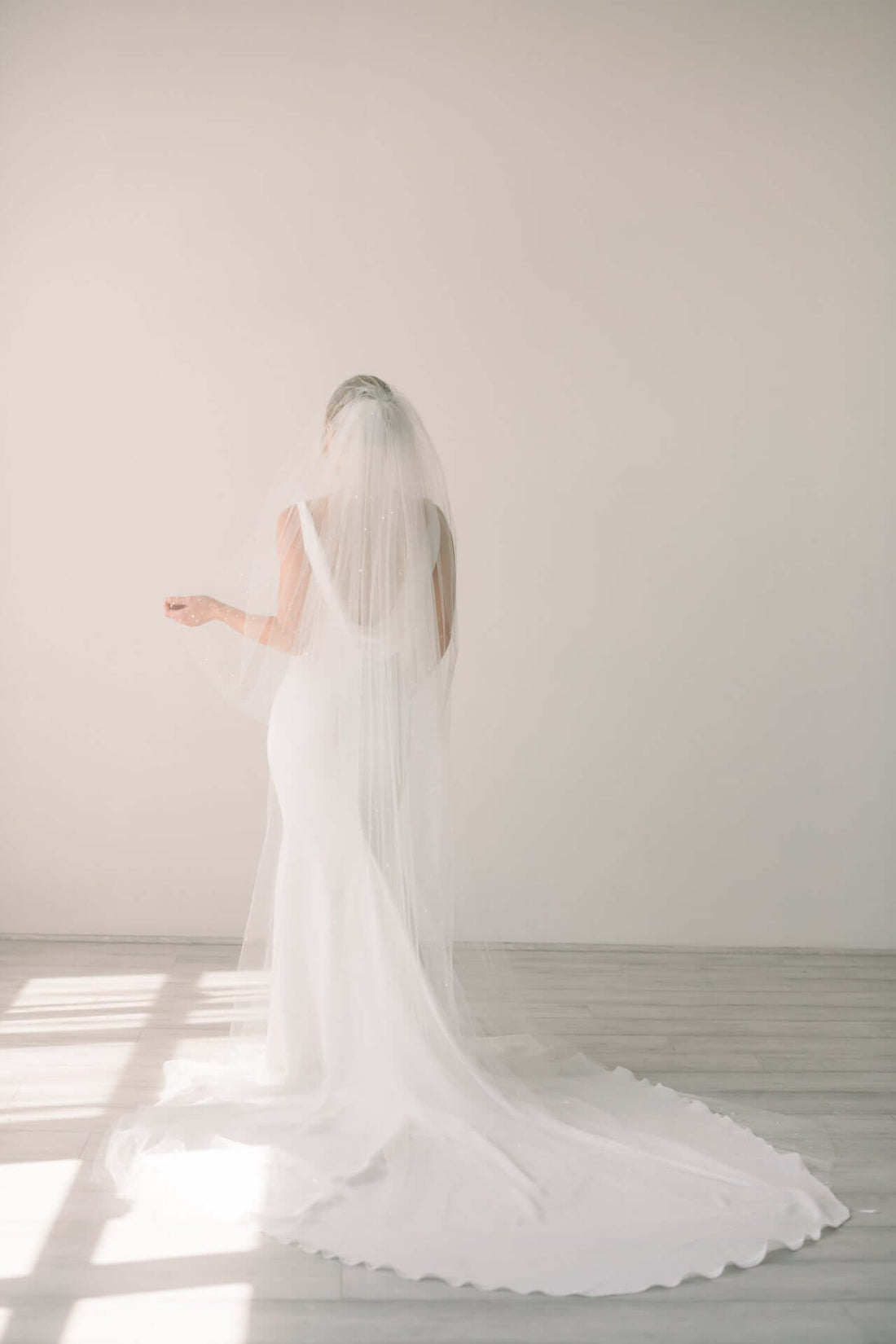 Should the veil go over or behind your shoulders?